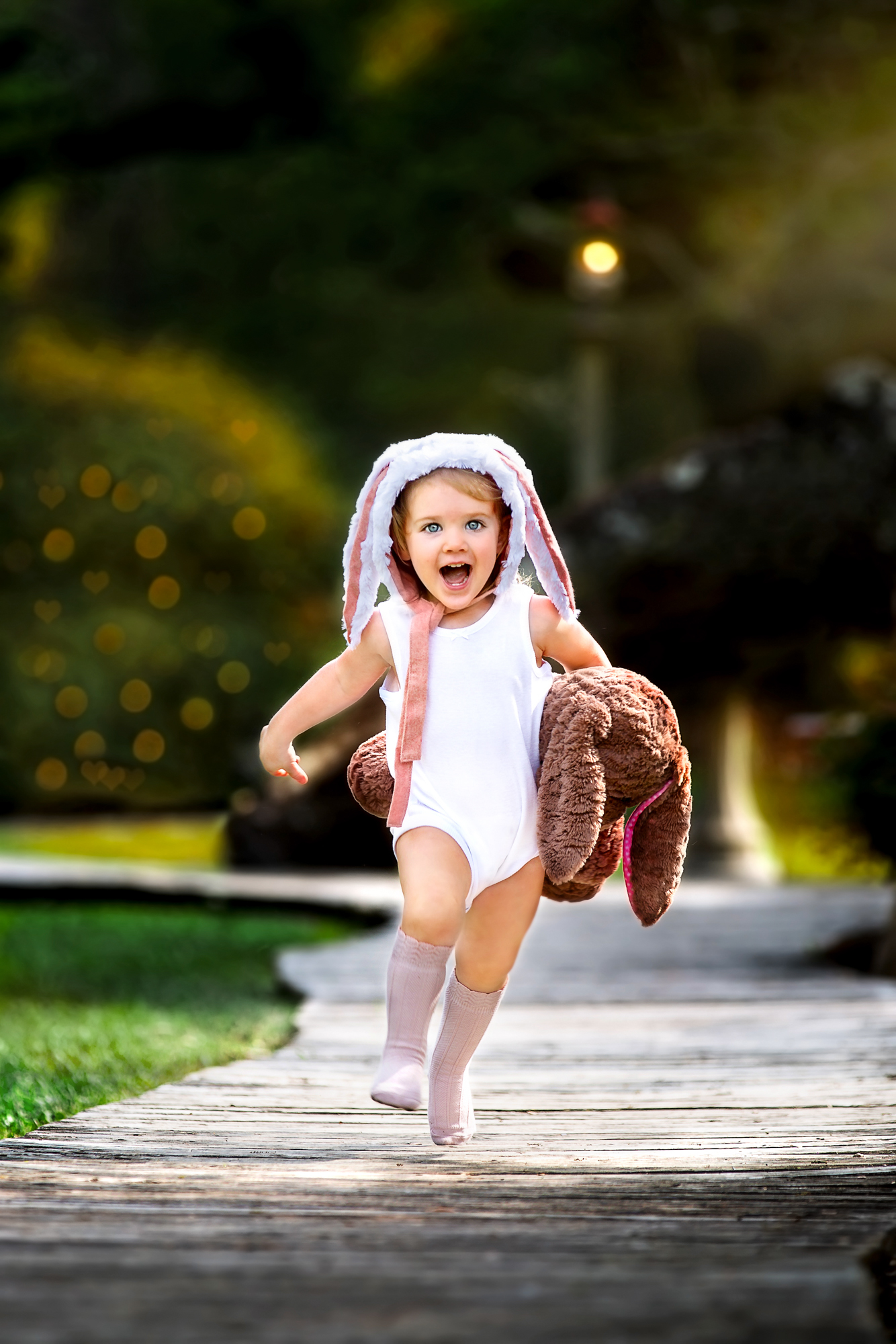 Adorable girl wearing a bunny bonnet running towards her Houston Pediatrician