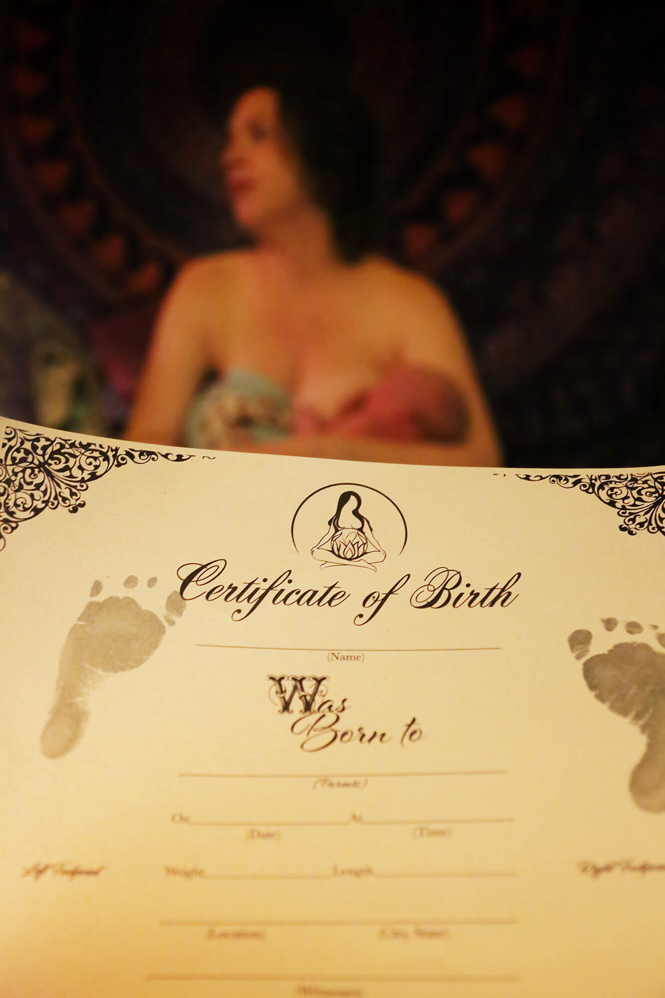Midwives holding a blank Birth Certificate with baby footprints, right after a home birth in Houston.