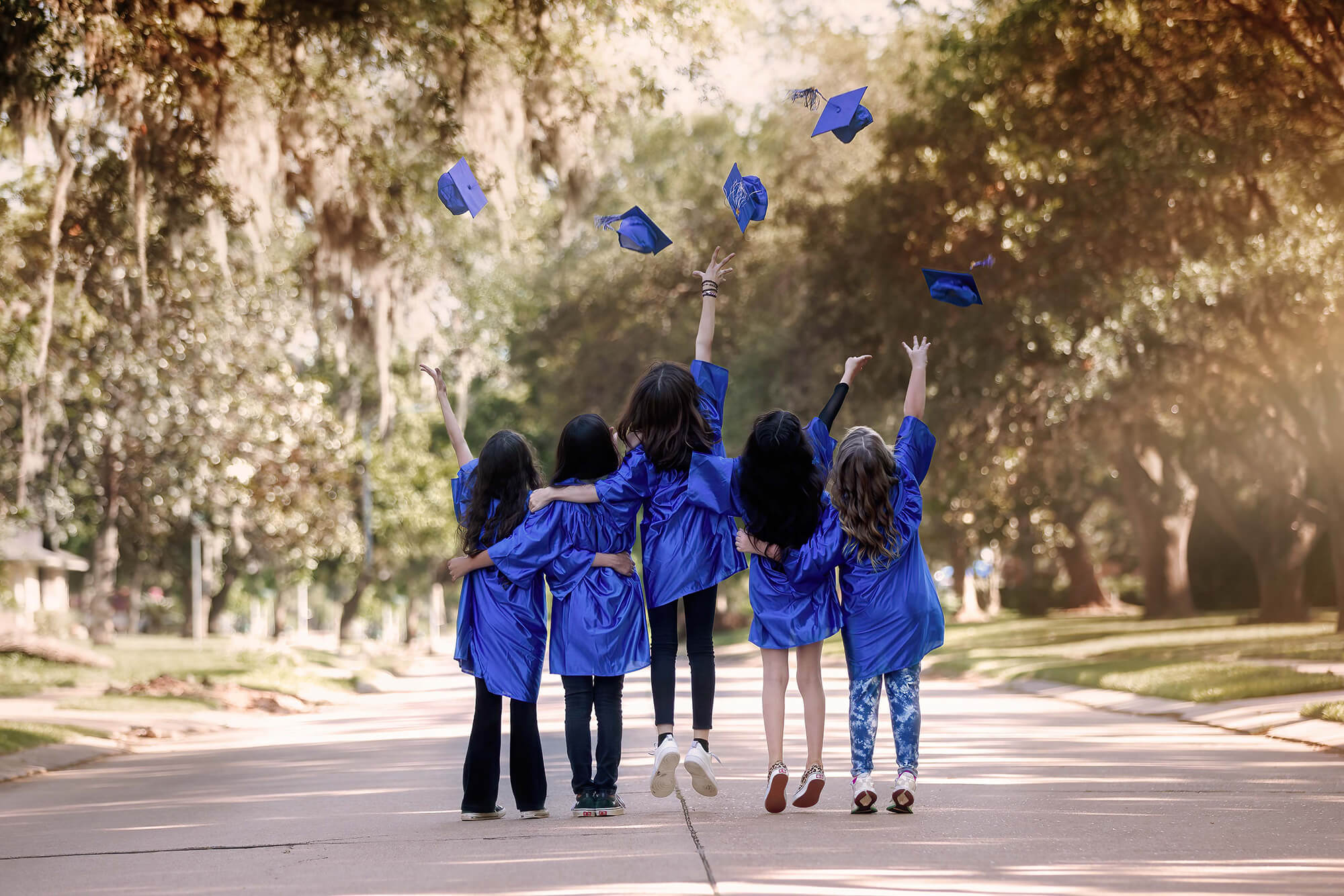 Five girls graduating one of the elementary private schools in Houston.