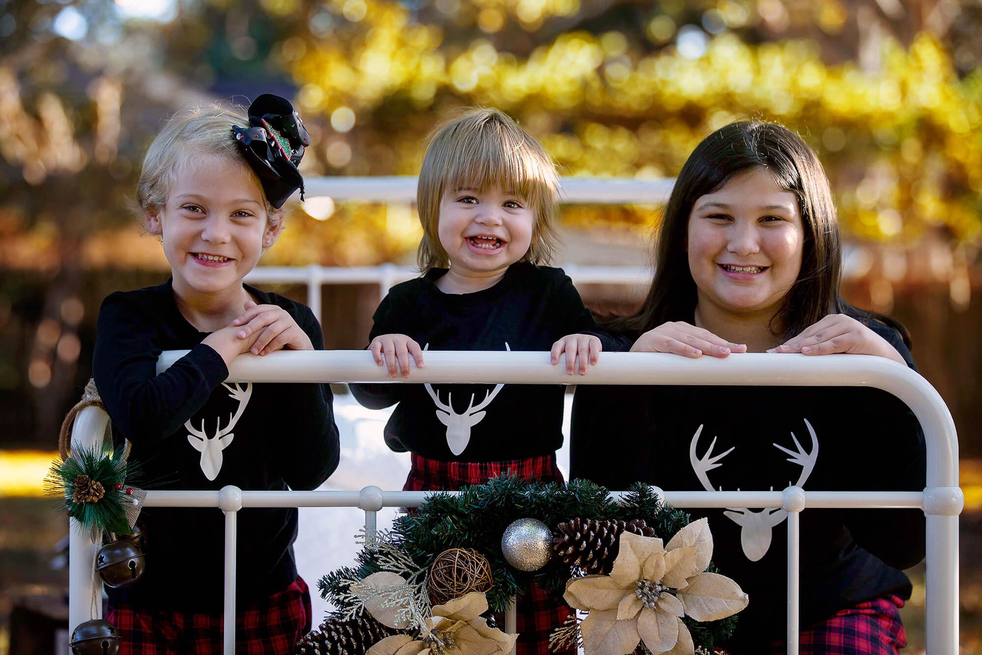 Adorable girls in their Christmas outfits ready to go see Christmas lights in Houston, Texas.