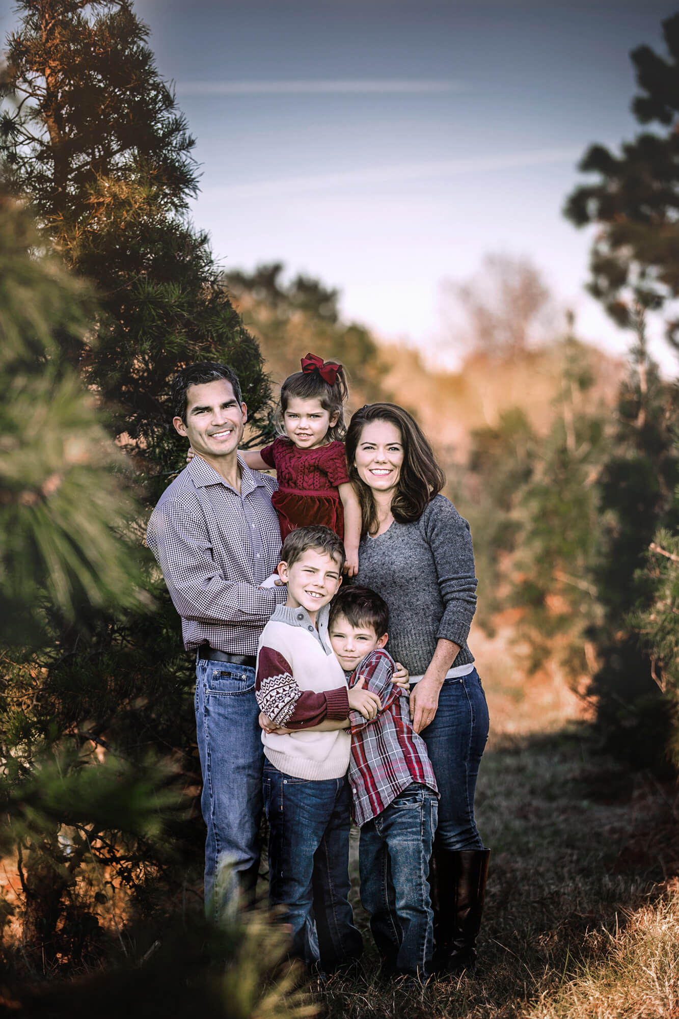 Beautiful family of five enjoying one of the best tree farms in Houston.