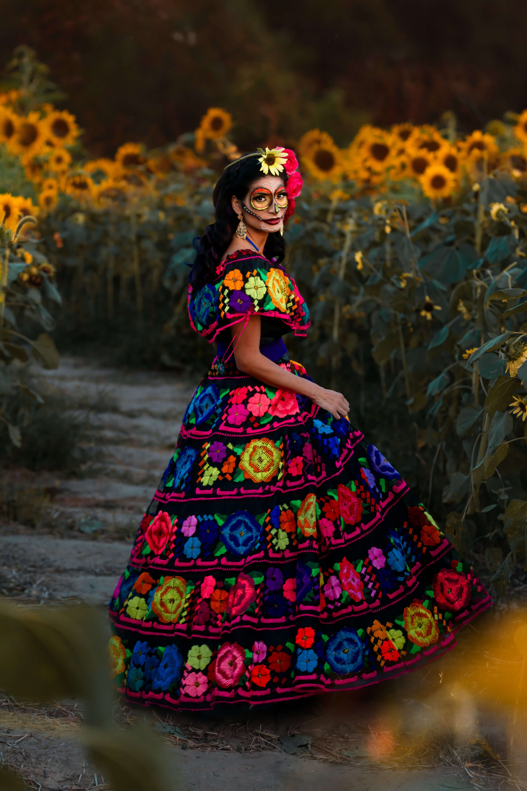 Beautifully dressed Mexican lady posing on a beautiful field of flowers in Houston to rise awareness for Gynecologists and Obstetricians.